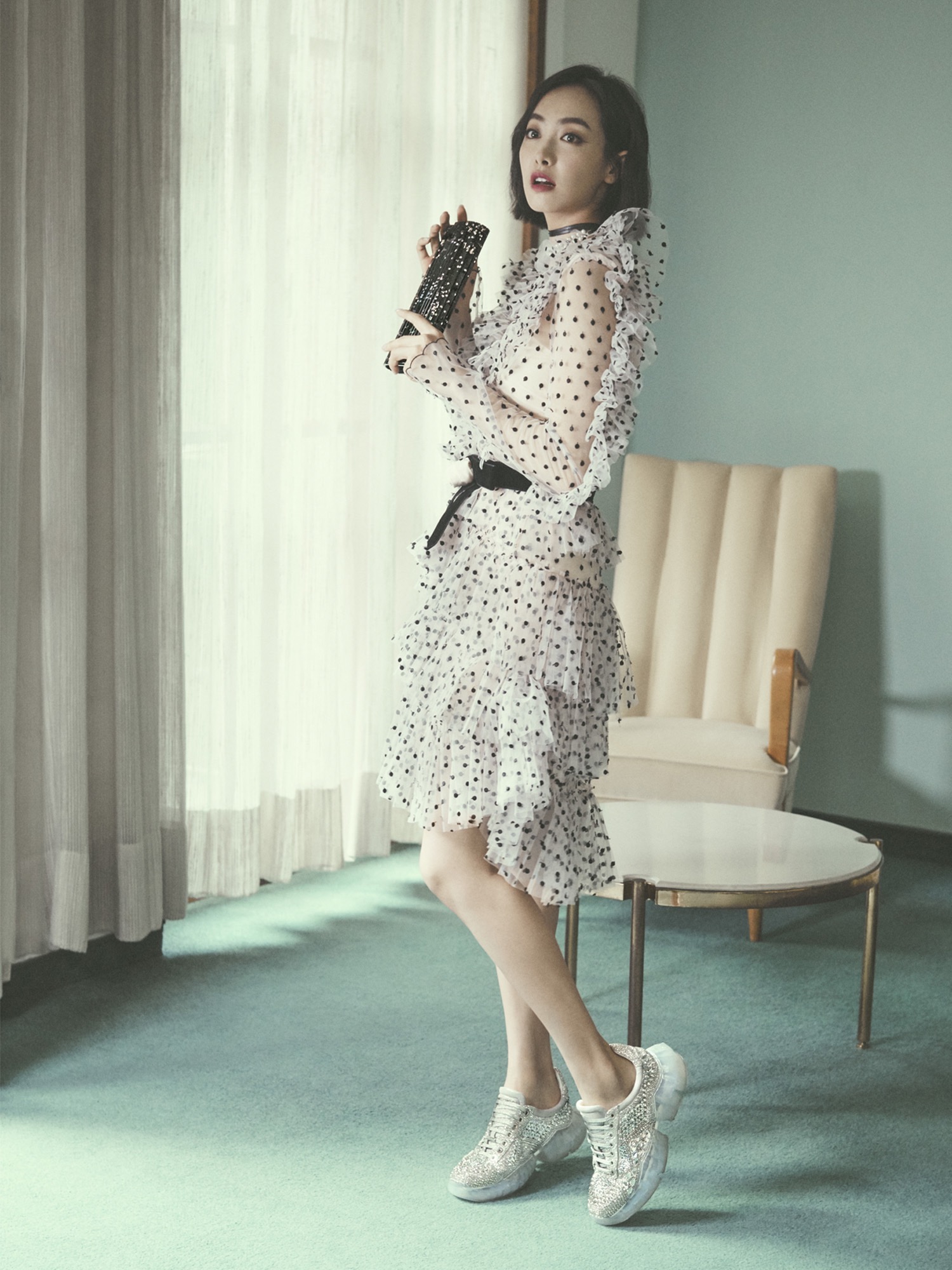 Victoria Song Qian carrying SWEETIE clutch bag and wearing DIAMOND sneakers